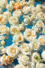 The pool filled with white rose flowers. Wedding decor