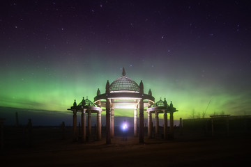 Obraz premium Aurora display in Yakutsk. The polar Northern lights aurora borealis sky star in Yakutia, Siberia, in place of the cult summer festivity Yhyakh Tuymaady of Yakuts, of the people of Yakutia