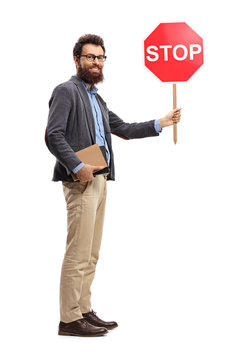 Man holding books and stop sign