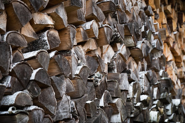 Firewood stacks with old and new woods. Natural colors