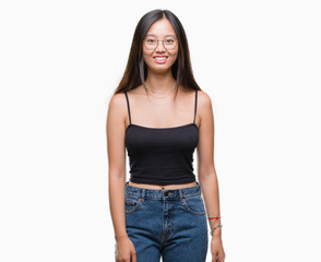 Fototapeta premium Young asian woman wearing glasses over isolated background with a happy and cool smile on face. Lucky person.