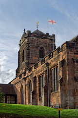 English flag on the tower of the Holy Trinity Parish Church in Sutton Coldfield, UK