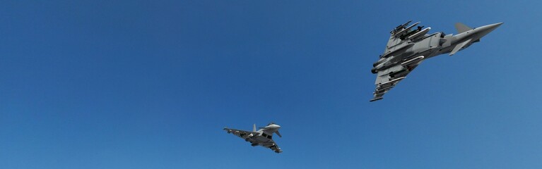military fighter jets - modern armed military fighter jets flys in formation