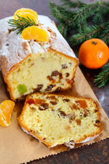 Christmas cake with nuts, dried fruit, tangerines. Traditional festive pastries.
