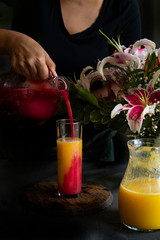 Woman pouring beet watermelon gingerale