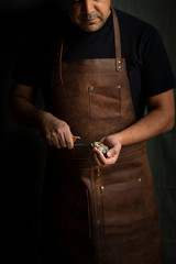 Man opening oyster