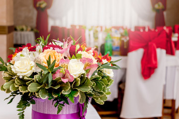 A stylish bouquet of flowers in the restaurant hall during the holiday_