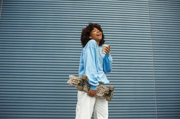 Portrait of happy girl smiling in urban area © vergor