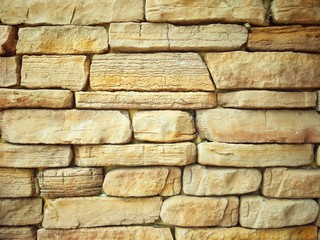 Part of the old slate bricks and stone wall, brown bricks stone wall pattern in vintage style on brickwork exterior decoration design concept