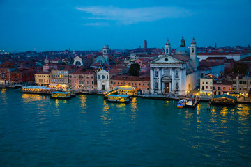 Night view of old houses on Grand Canal in Venice in Italy