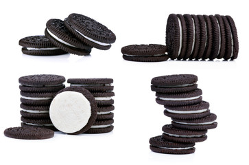 Chocolate cookies with cream filling tower isolated on white background.