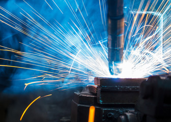 Welding robots movement in a car factory,