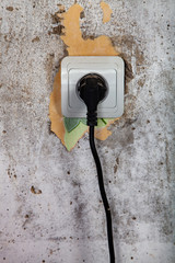 Socket on a gray wall.