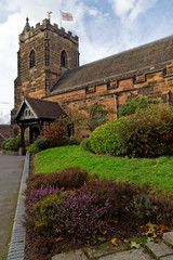 Fototapeta premium Alley leading to the Holy Trinity Parish Church in Sutton Coldfield, UK