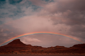 Fototapeta na wymiar Rainbow over Red Rock Mountains
