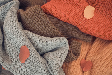 Fototapeta na wymiar Warm knitted multi-colored autumn sweaters