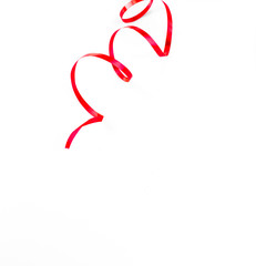 Red ribbon pieces on white background