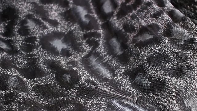 Fashion fabric rotating texture pattern closeup footage