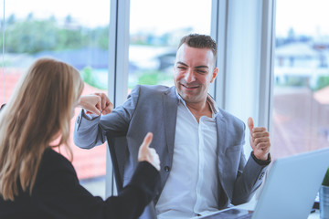 Boss thumb up for female worker compliment