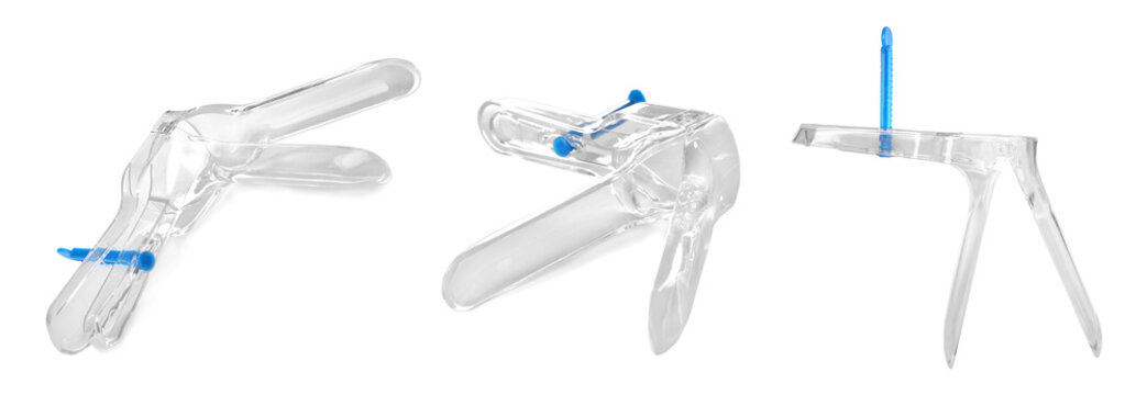 Set with gynecological speculum on white background. Medical objects