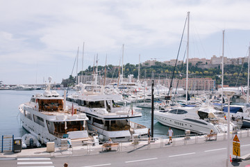 Fototapeta premium Yachts and ships in the port of Monaco in summer solar Europe