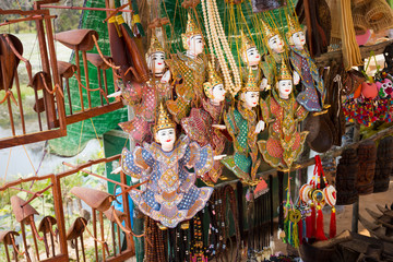 Naklejka premium Sale of traditional souvenirs in the street market at Siem Reap, Cambodia