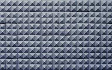 Fototapeta premium concrete wall texture stucco cement white and gray geometric seamless triangle pyramid background with shadow and light.