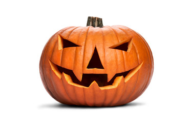 A carved halloween pumpkin with evil eyes and face isolated on white.