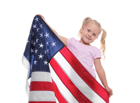 Portrait of cute little girl with American flag on white background
