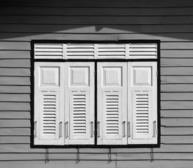 Fototapeta premium wood window at wood antique house in southeast asia - thailand. - monochrome
