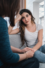 depressed woman being embrace by her friend