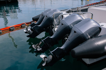 Boat motor black motors installed on the yacht
