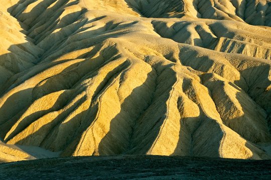 Scenic Zabriske Point in Death Valley National Park at sunset.