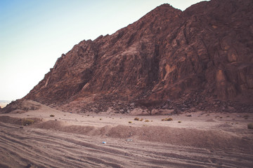 Desert in Egypt. Sharm el Sheikh. Sand and Sand Borkhan. Rock and sunset.
