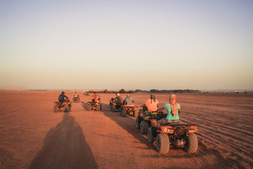 Desert in Egypt. Sharm el Sheikh. Sand and Sand Borkhan. Rock and sunset. Quad Cycle Travel. Excursion with people. © Yaroslav