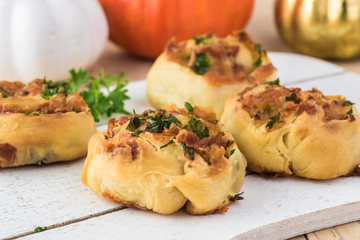 Homemade cheesy bacon holiday rolls.