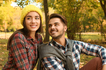 Fototapeta premium Young lovely couple spending time together in park. Autumn walk