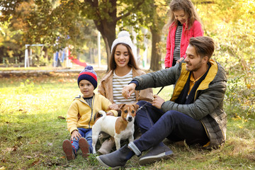 Happy family with children and dog in park. Autumn walk