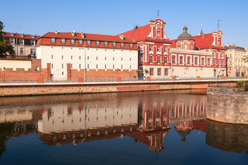 Wroclaw, Poland, August 2018.Ossolineum Library. With reflection in Odra River in the morning sun.