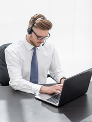 business center employee working on a laptop