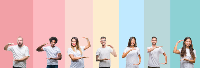 Collage of different ethnics young people wearing white t-shirt over colorful isolated background gesturing with hands showing big and large size sign, measure symbol. Smiling looking at the camera