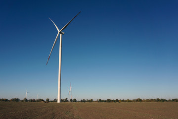 Eco power, wind turbines with blue sky. wind turbine for alternative electricity.renewable electric farm with sustainable eco-friendly technology using wind energy rotation for wind turbines renewable