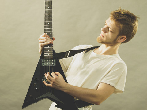 Man playing on electric guitar