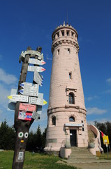 Tower and tourist routes signs on Great Owl (Wielka Sowa)(Hohe Eule)  mountain height of 1015 metres (3,329 ft) is the highest peak of the Owl Mountai