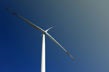 Eco power, wind turbines with blue sky. wind turbine for alternative electricity.renewable electric farm with sustainable eco-friendly technology using wind energy rotation for wind turbines renewable