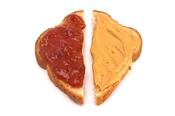 A Classic Peanut Butter and Strawberry Jelly Sandwich on Wheat Bread