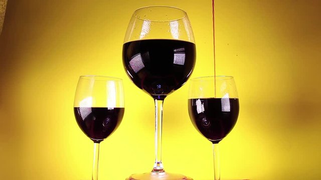 Red wine glass glasses yellow background