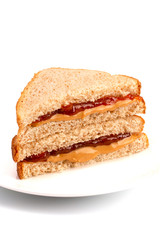 A Classic Peanut Butter and Strawberry Jelly Sandwich on Wheat Bread