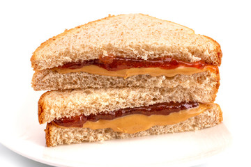 A Classic Peanut Butter and Strawberry Jelly Sandwich on Wheat Bread