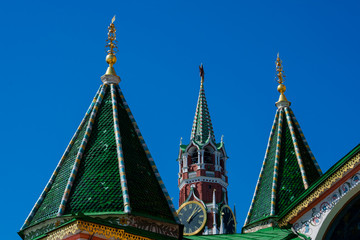Fototapeta na wymiar Saint Basil's Cathedral (Sobor Vasiliya Blazhennogo) and Spasskaya Tower (Saviour Tower). Red Square. Moscow, Russia